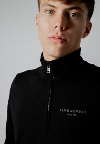 GAS LUSTIG POCKET - Sweater met rits - black