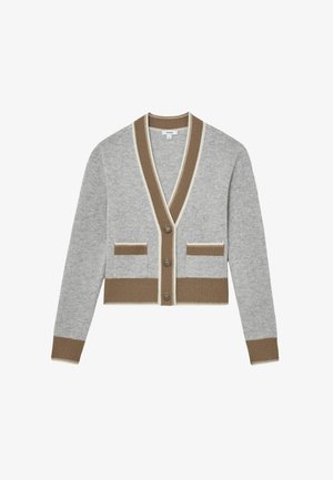 Siva jopa z V-izrezom, rjavim robom in dvema sprednjima žepoma. Ima pet gumbov in rebrasto teksturo na manšetah in spodnjem robu.