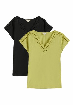 Two short-sleeve V-neck tops with eyelet lace trim, one in black and one in light green, displayed on a white background.