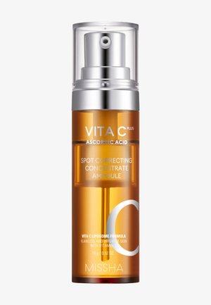 MISSHA Vita C Plus askorbiinihappo täsmäkorjaava tiivisteampulli pullo hopeisella pumppupulpetilla.