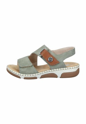 Sandale à bout ouvert verte et marron avec brides ajustables, semelle intérieure beige rembourrée et semelle épaisse blanche et marron pour le confort et le soutien.