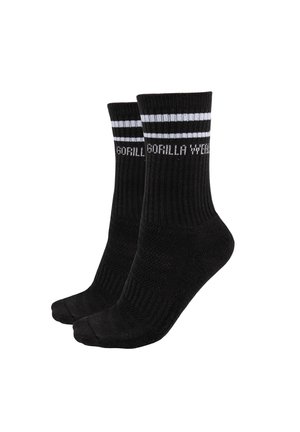Schwarze Sportsocken mit geripptem oberen Teil, die zwei weiße Streifen und das in Weiß gestrickte "GORILLA WEAR"-Logo an der Seite haben.