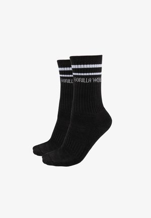 Zwarte sportsokken met ribbel bovenkant, voorzien van twee witte strepen en het 'GORILLA WEAR' logo gebreid in het wit aan de zijkant.