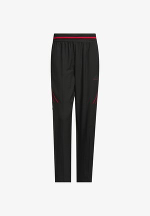 Crne sportske hlače s crnom i crvenom prugastom pojasom, suženi dizajn, glatka tekstura i bočne akcenti u crvenoj boji radi bolje vidljivosti.