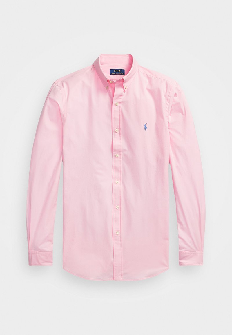 Ljusrosa skjorta med knäppning, tillverkad av bomull, med spetsig krage, långa ärmar och en liten blå broderad logotyp på bröstet.