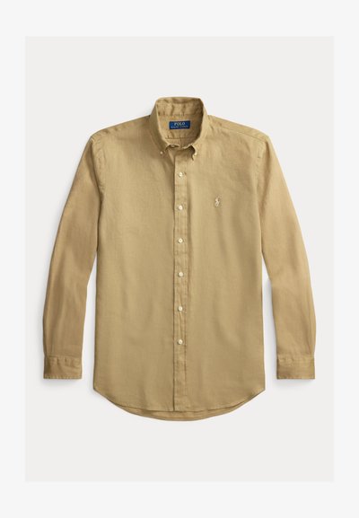 Koszula z długim rękawem zapinana na guziki w kolorze khaki. Wykonana z teksturowanej tkaniny, z prostym dołem, ozdobiona małym haftowanym logo na piersi.