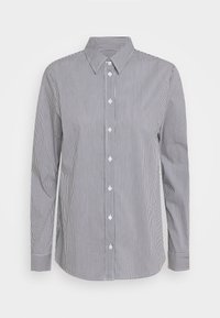 Raitapaidassa sinivalkoisia raitoja, jossa on kaulus, pitkät hiharat ja kapea malli, valmistettu kevyestä kudotusta kankaasta.