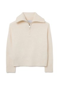 Helle beige Zip-Top mit geripptem Kragen und Bündchen. Weicher Stoff, cropped Design und eine dezente, glatte Oberfläche.