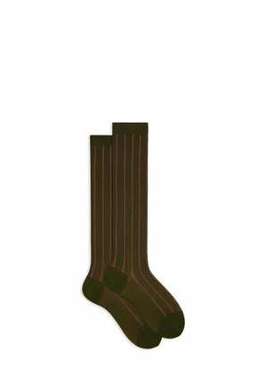 Green socks with vertical lavender stripes, made from a soft fabric, featuring ribbed cuffs and a smooth texture throughout.