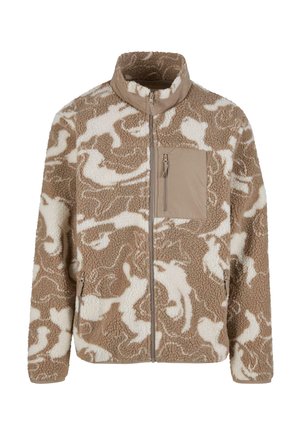 Brūns un krēmkrāsas vilnas jakas ar abstraktu rakstu, augstu apkakli, priekšējo rāvējslēdzēju un krūšu kabatu. Mīksta tekstūra ar brīvu piegriezumu.