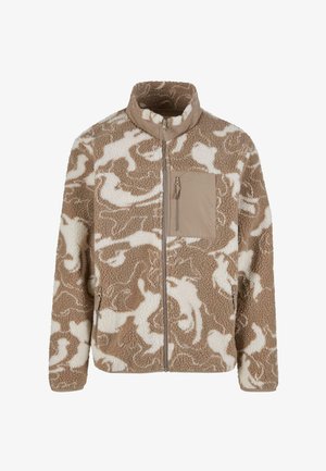 Barna és krém színű bolyhos dzseki absztrakt mintával, magas gallérral, elülső cipzárral és mellzsebbel. Puha tapintású, laza szabású.