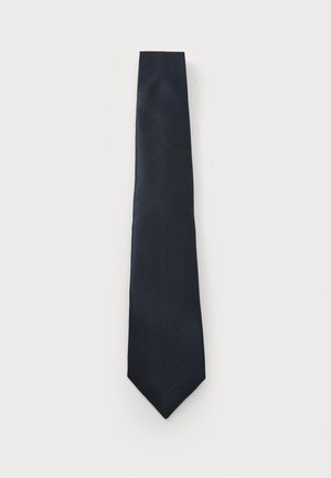 Mørkeblå slips med struktureret stof, smalt design og spidse ender. Materialet har et diskret mønster for ekstra detaljer.