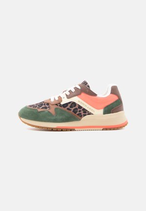 Low-top sneaker with green suede, brown leather, leopard print fabric, coral accents, white laces, and beige sole with "Scotch & Soda" branding.