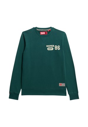 Donkergroen sweatshirt met ronde hals, voorzien van witte tekst "SUPER DRY 86", ribgebreide manchetten en zoom. Inclusief een logopatch aan de onderkant.