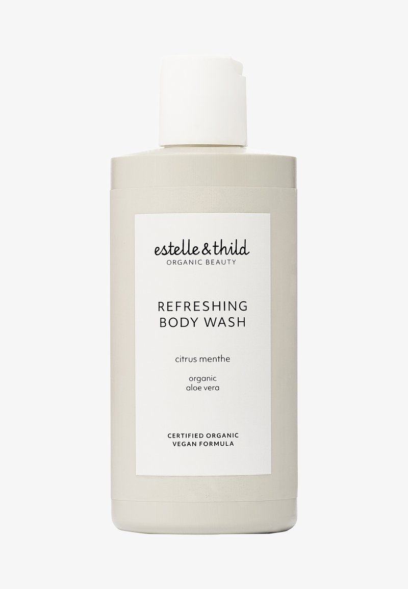 Uppfriskande kroppstvål i en ljus beige flaska med ett vitt lock. Etiketten har svart text som beskriver produktens namn och ingredienser.