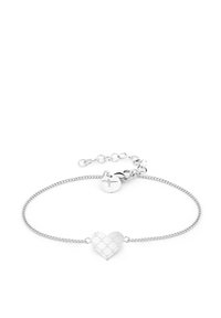 Silver chain bracelet featuring a heart-shaped charm with a textured surface and a small circular tag with a cross accent. Adjustable closure.