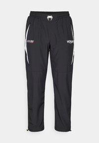 BUD JOGGERS - Tracksuit bottoms - black/white/lime green