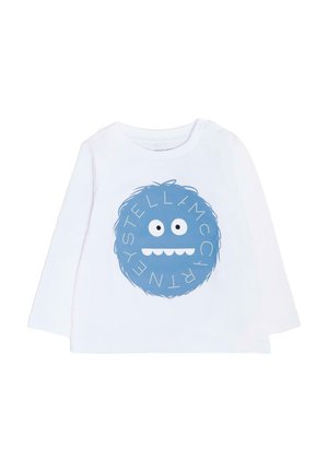 Biała koszula z długim rękawem z okrągłym niebieskim wzorem przedstawiającym wesołą twarz potwora oraz napisem "STELLA McCARTNEY" w białych akcentach.