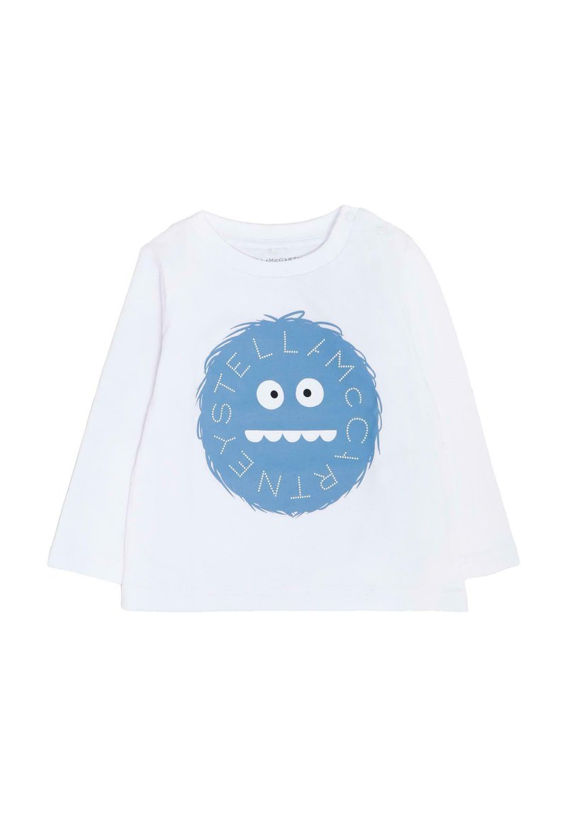 Camicia bianca a maniche lunghe con una grafica rotonda blu che presenta un volto di mostro giocoso e il testo "STELLA McCARTNEY" con accenti bianchi.