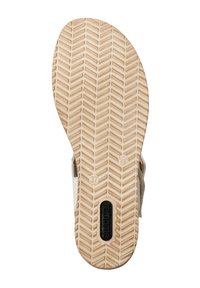Semelle de sandale en caoutchouc beige avec un motif en chevrons texturé. Taille indiquée comme 37 ; comporte un logo de marque en noir.