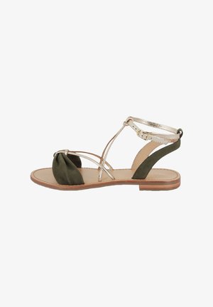 Green fabric sandal with gold metallic straps, knotted front detail, and ankle strap. Flat sole with a natural wood finish.