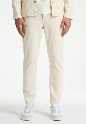 HELYX CURRENT PRO - Kavbojke na korenček - off-white