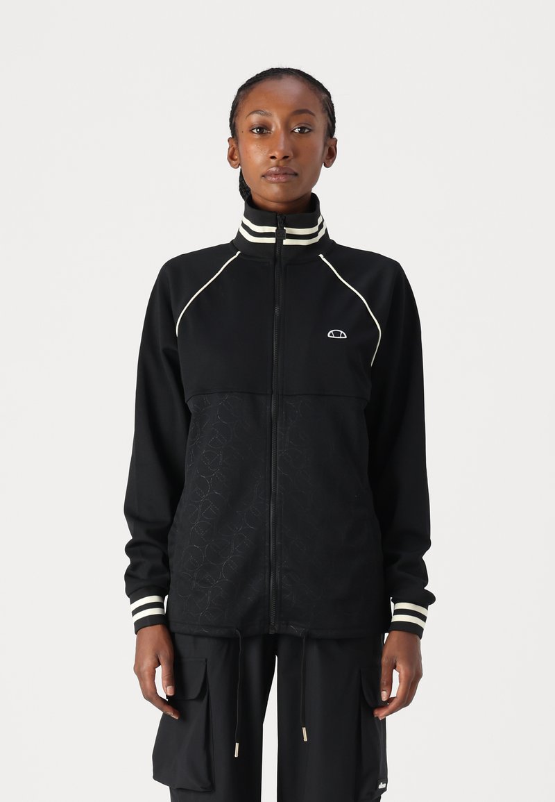 Crna jakna za trčanje s patentnim zatvaračem, ima teksturirani donji panel te kontrastne bijele trakaste rukave i ovratnik.