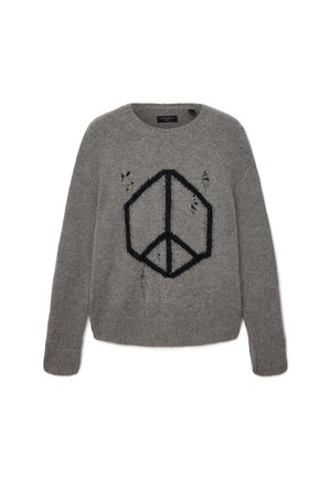 Maglione grigio a maglia con un simbolo di pace geometrico nero sul davanti e buchi consumati voluti in tutta la superficie.