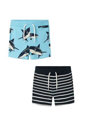 Blue swim shorts with shark print and white drawstring, paired with navy striped shorts featuring a matching drawstring.