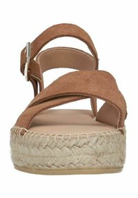 Brown suede wedge sandal with cross straps and adjustable buckle. Jute-woven platform base adds texture and height. Flat insole for comfort.