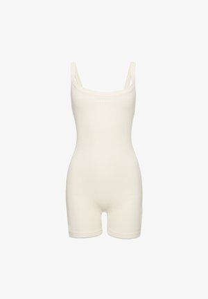 Bavlněný kombinéza ve smetanové barvě s tenkými ramínky, kulatým výstřihem a přiléhavou siluetou, se strukturovaným žebrovaným vzorem.
