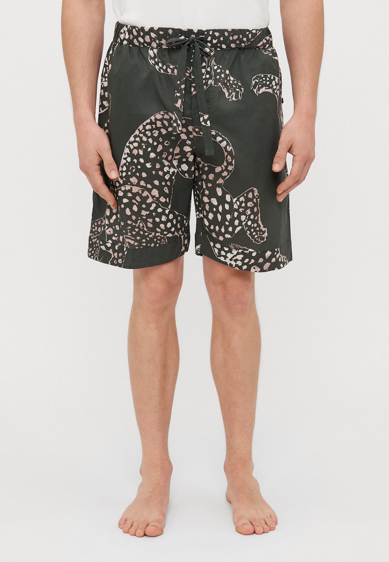 Shorts de bain noirs avec un imprimé animal rose et blanc, taille élastique avec cordon de serrage, longueur genou, tissu léger.