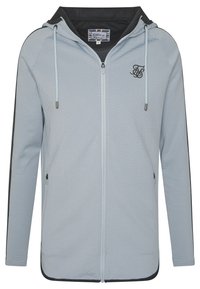 Lys blå mesh zip-up hættetrøje med sort hætte, sølvfarvet hårdvarer, sidelommer og broderet logo på brystet. Glat, åndbart stof.