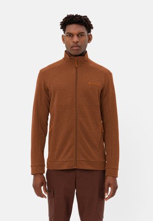 Brown zip-up jacket with textured fabric, high collar, and orange accents. Features two front pockets and ribbed cuffs.