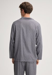 Gray pajama set featuring a long-sleeve top and elastic waistband pants. The fabric has a subtle diamond pattern with a smooth texture.