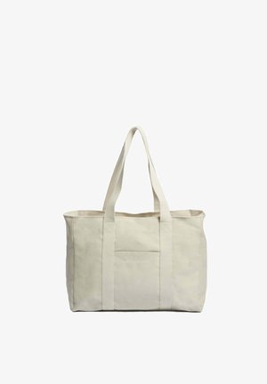 Borsa tote in tela beige con grande apertura, due robuste maniglie per il trasporto e una tasca frontale con il nome del marchio "SOULEWAY."