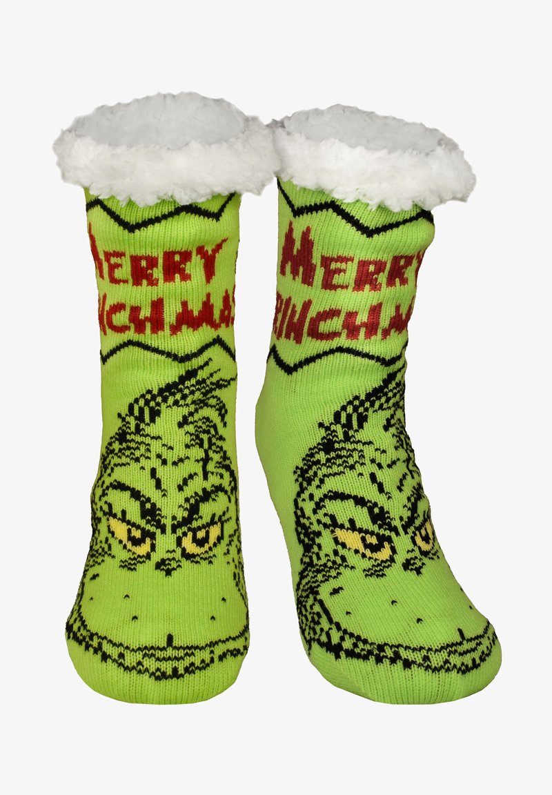 Calze di Natale a tema Grinch verde con polsini bianchi e soffici e il testo rosso "Merry Grinchmas" su ciascuna calza.