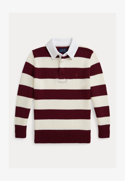 Bordo un balti svītrots polo džemperis ar apkaklīti, garām piedurknēm un ribotām aprocēm. Uz kreisā krūtīm ir mazs logs virs kabatas.