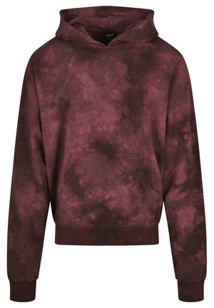 Bordo spalvos džemperis su tinklelių raštu, su raišteliais reguliuojamo dydžio kapuci, kengūros kišene ir kantais. Pagamintas iš minkštos medžiagos, su lengvu sijonu.