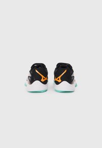 Black athletic shoes with orange and white accents, featuring a mesh upper, cushioned sole, and a textured rubber outsole in turquoise.
