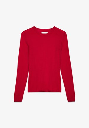 Rdeča pletena jopica z dolgimi rokavi in okroglim izrezom. Ima gladko teksturo ter oprijet silhueto z rebrastimi manžetami in robom.