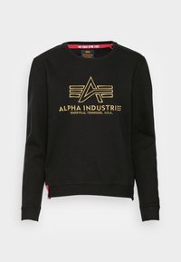 Sweat-shirt noir en coton, doté d'un col rond, de manches longues et d'un logo doré imprimé avec une étiquette rouge superposée à l'ourlet.
