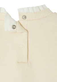 Helle beige Strickpullover mit einem gerippten Kragen, der mit Druckknöpfen am Hals versehen ist und eine weiche Stoffstruktur aufweist. Akzentuiert mit einem kontrastierenden weißen Innenkragen.