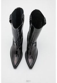 Black leather ankle boots with a shiny, textured finish, pointed toes, and two loops for easy pull-on. Clean, minimalist design.