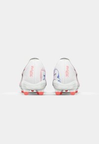 White football boots with a light gradient of blue and pink accents. Features a smooth upper, black detailing, and bright red studs.