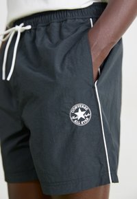 Converse RETRO CHUCK ELEVATED - Tréningruha alsók - black