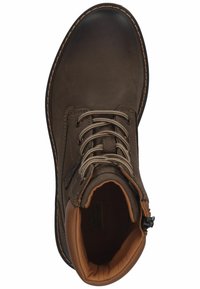 Brown leather boot with a rounded toe, textured finish, brown interior lining, and gray laces. Features stitched accents and a zip closure.