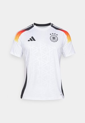 White soccer jersey with black accents, gradient orange-yellow shoulder design, three stars, and a textured geometric pattern.