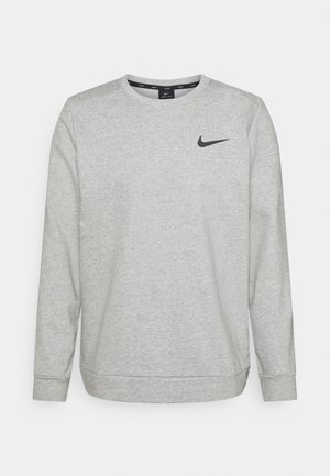 Sudadera Nike gris claro de manga larga con cuello redondo y logo Swoosh negro en el pecho izquierdo, fabricada con tela Dri-FIT.
