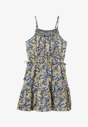 Robe d'été florale avec des fleurs bleues et jaunes sur un fond beige clair. Buste smocké, bretelles réglables et jupe à volants.
